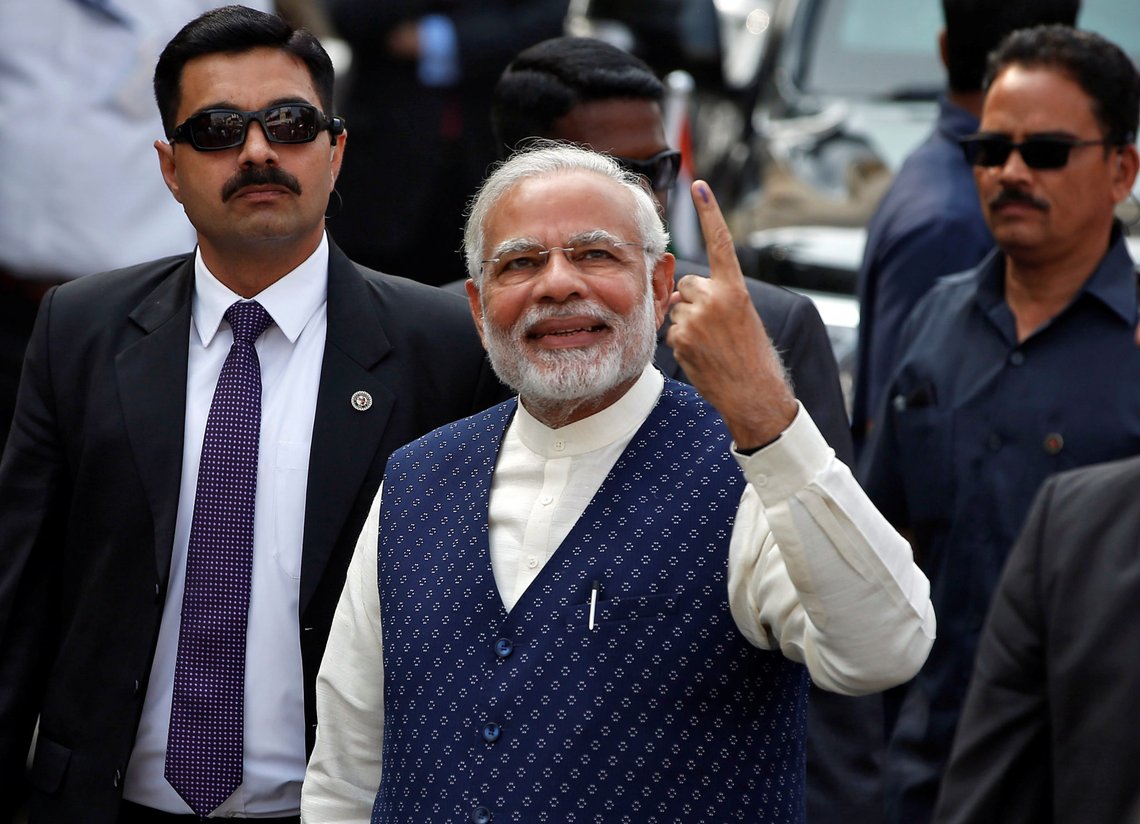 India's Prime Minister Narendra Modi shows his ink-marked finger after casting his vote outside a polling station during the last phase of Gujarat state assembly election in Ahmedabad, India, December 14, 2017. REUTERS/Amit Dave India's Prime Minister Narendra Modi shows his ink-marked finger after casting his vote outside a polling station during the last phase of Gujarat state assembly election in Ahmedabad, India, December 14, 2017. REUTERS/Amit Dave