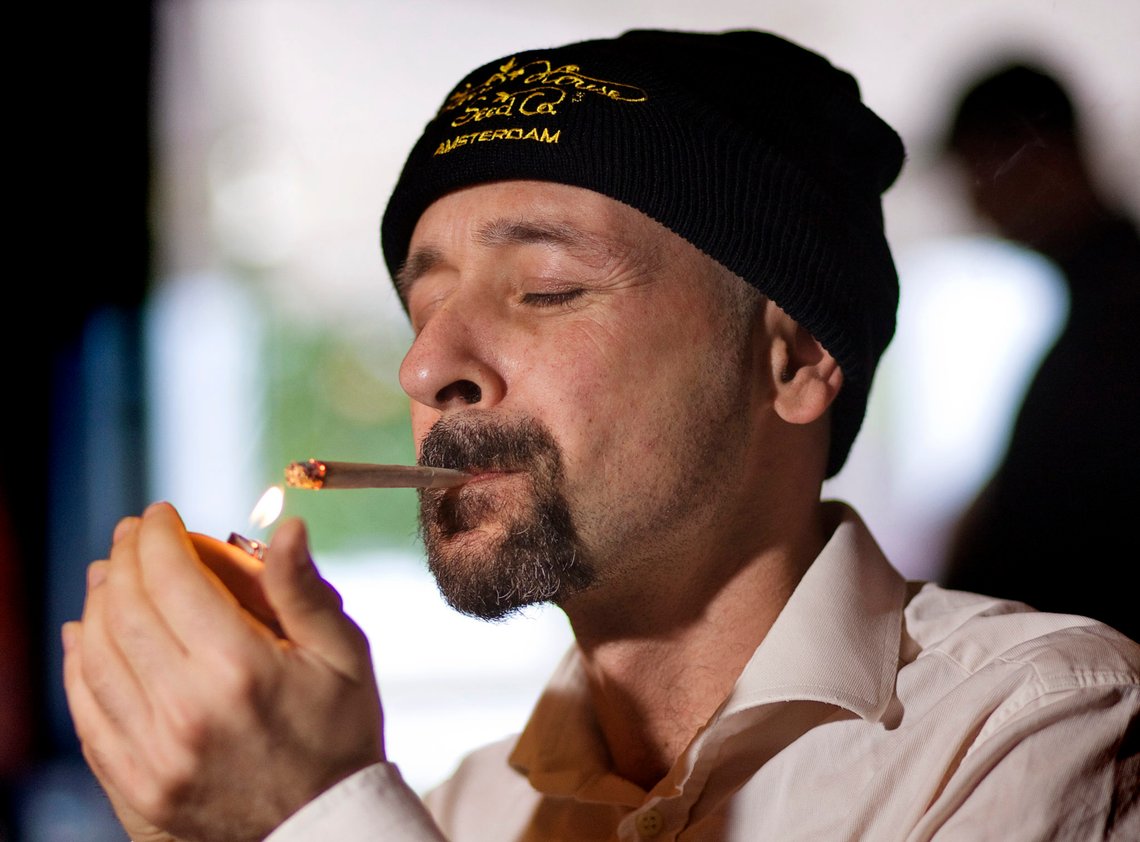 Christian Avarello from Italy lights up a joint purely made of marijuana in a coffeeshop in Amsterdam June 27, 2008. When a smoking ban comes into force in the Netherlands July 1, it may kill the buzz for people who like to smoke their cannabis with tobacco. But the new rules contain a few loopholes -- People will still be able to smoke pure cannabis joints in around 700 coffee shops, something some tourists already often do. To match feature DUTCH-COFFEESHOPS/
REUTERS/Michael Kooren (NETHERLANDS) Christian Avarello from Italy lights up a joint purely made of marijuana in a coffeeshop in Amsterdam June 27, 2008. When a smoking ban comes into force in the Netherlands July 1, it may kill the buzz for people who like to smoke their cannabis with tobacco. But the new rules contain a few loopholes -- People will still be able to smoke pure cannabis joints in around 700 coffee shops, something some tourists already often do. To match feature DUTCH-COFFEESHOPS/
REUTERS/Michael Kooren (NETHERLANDS)