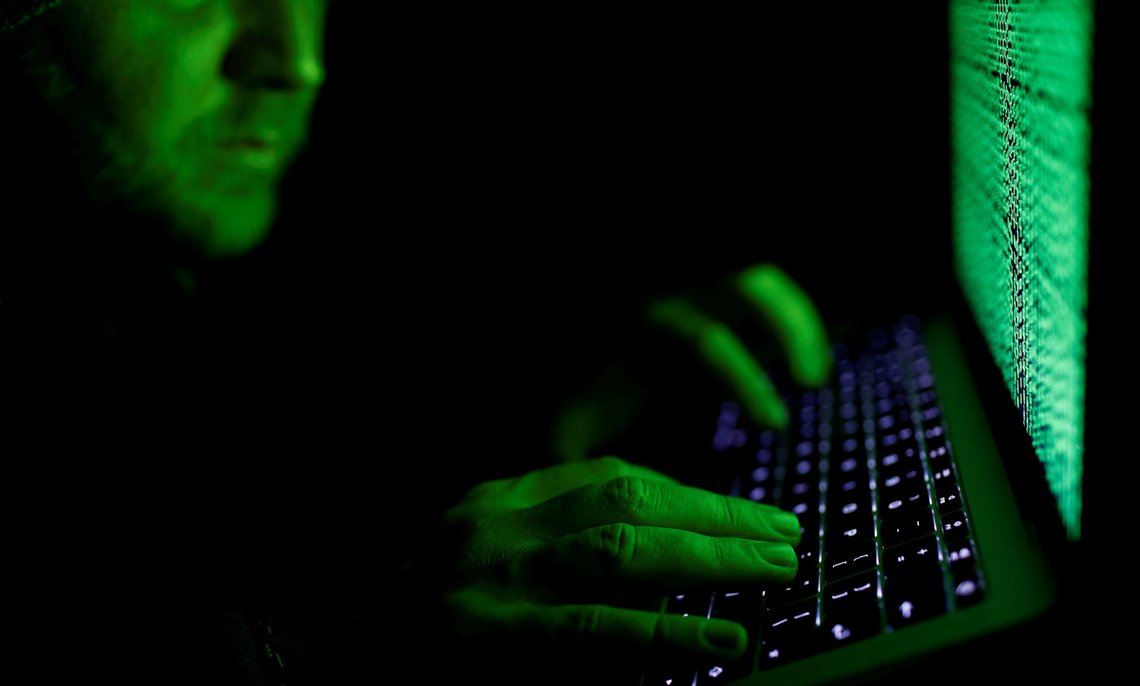 FILE PHOTO: A man types on a computer keyboard in front of the displayed cyber code in this illustration picture taken on March 1, 2017. REUTERS/Kacper Pempel/Illustration/File Photo FILE PHOTO: A man types on a computer keyboard in front of the displayed cyber code in this illustration picture taken on March 1, 2017. REUTERS/Kacper Pempel/Illustration/File Photo