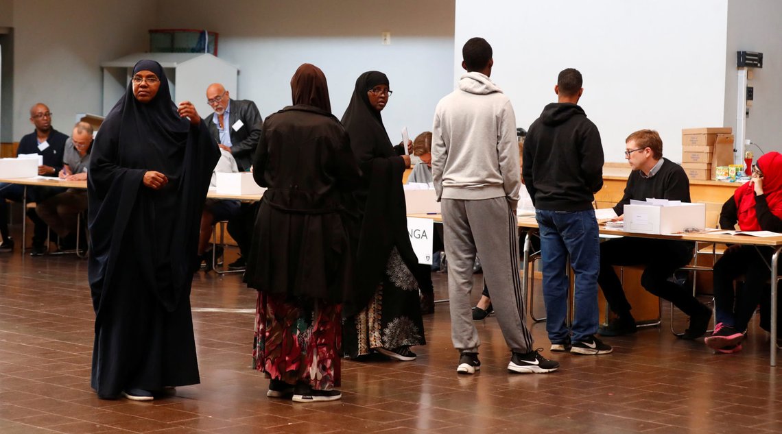 People arrive at a polling station during a general election, in the Rinkeby neighbourhood in Stockholm, Sweden September 9, 2018. REUTERS/Ints Kalnins People arrive at a polling station during a general election, in the Rinkeby neighbourhood in Stockholm, Sweden September 9, 2018. REUTERS/Ints Kalnins