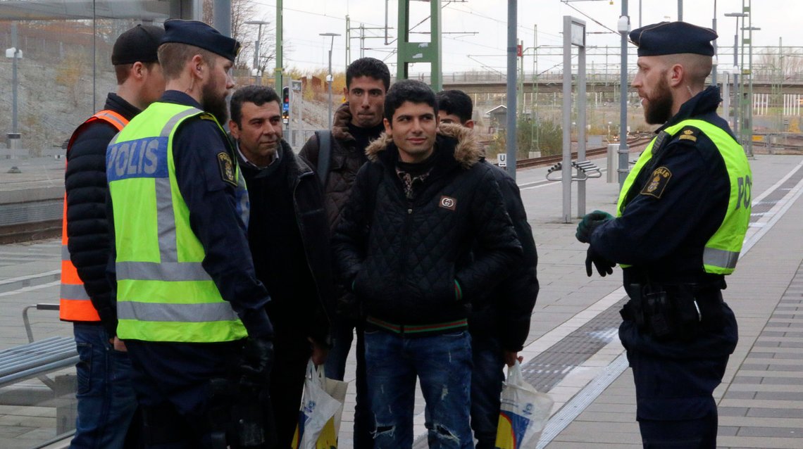 Swedish police officers speak to a group of people at the Hyllie train station near Malmo, Sweden, November 12, 2015. Swedish police began bordering trains on Thursday arriving from Denmark as they imposed the first large-scale border controls in two decades to deal with a refugee influx, but there were no signs the numbers of immigrants were slowing. REUTERS/Staff Swedish police officers speak to a group of people at the Hyllie train station near Malmo, Sweden, November 12, 2015. Swedish police began bordering trains on Thursday arriving from Denmark as they imposed the first large-scale border controls in two decades to deal with a refugee influx, but there were no signs the numbers of immigrants were slowing. REUTERS/Staff