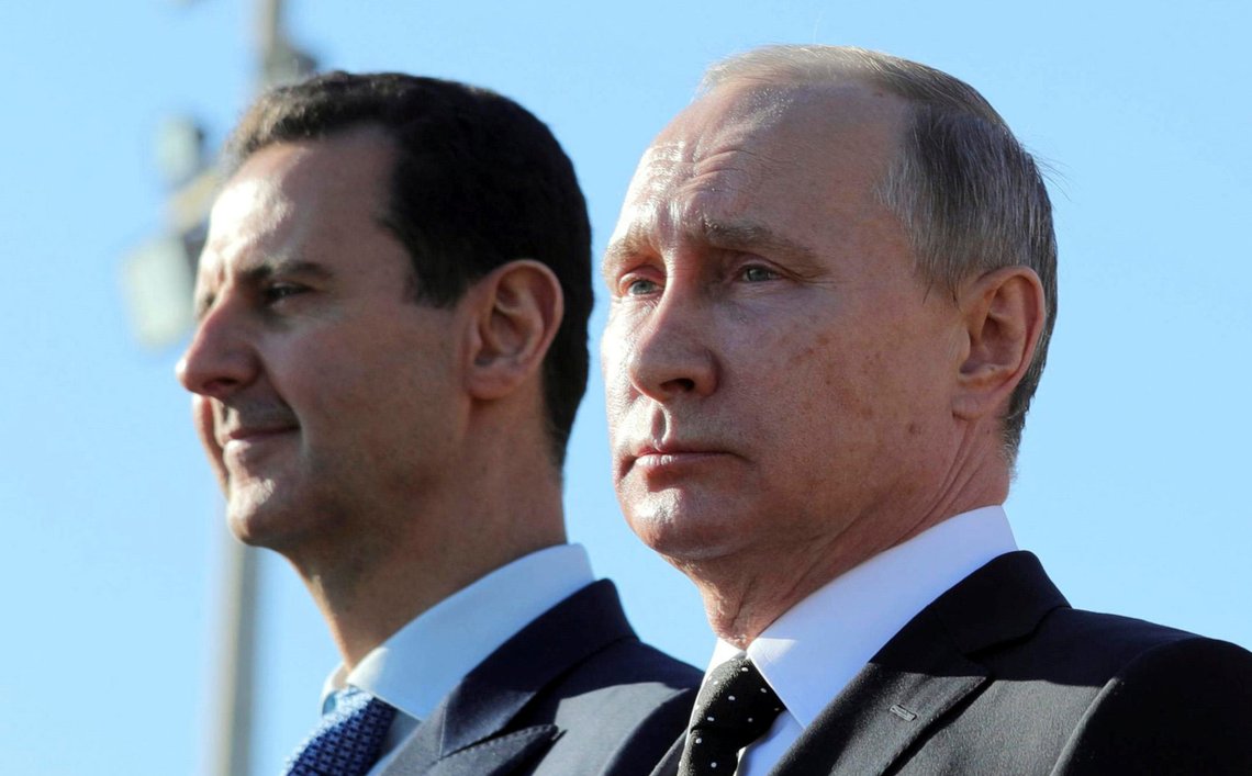 Russian President Vladimir Putin (R) and Syrian President Bashar al-Assad visit the Hmeymim air base in Latakia Province, Syria December 11, 2017. Picture taken December 11, 2017. To match Special Report RUSSIA-FLIGHTS/ Sputnik/Mikhail Klimentyev/ via REUTERS/File Photo ATTENTION EDITORS - THIS IMAGE WAS PROVIDED BY A THIRD PARTY. Russian President Vladimir Putin (R) and Syrian President Bashar al-Assad visit the Hmeymim air base in Latakia Province, Syria December 11, 2017. Picture taken December 11, 2017. To match Special Report RUSSIA-FLIGHTS/ Sputnik/Mikhail Klimentyev/ via REUTERS/File Photo ATTENTION EDITORS - THIS IMAGE WAS PROVIDED BY A THIRD PARTY.