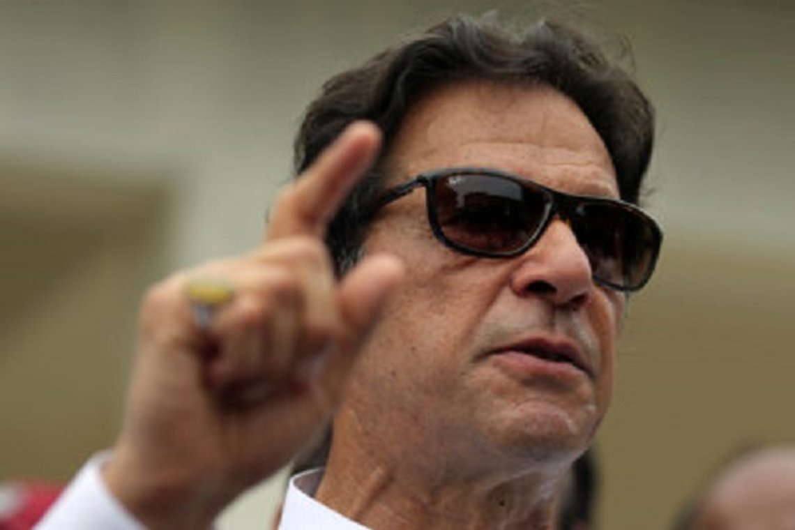 Cricket star-turned-politician Imran Khan, chairman of Pakistan Tehreek-e-Insaf (PTI), speaks to members of media after casting his vote at a polling station during the general election in Islamabad, Pakistan, July 25, 2018. REUTERS/Athit Perawongmetha Cricket star-turned-politician Imran Khan, chairman of Pakistan Tehreek-e-Insaf (PTI), speaks to members of media after casting his vote at a polling station during the general election in Islamabad, Pakistan, July 25, 2018. REUTERS/Athit Perawongmetha