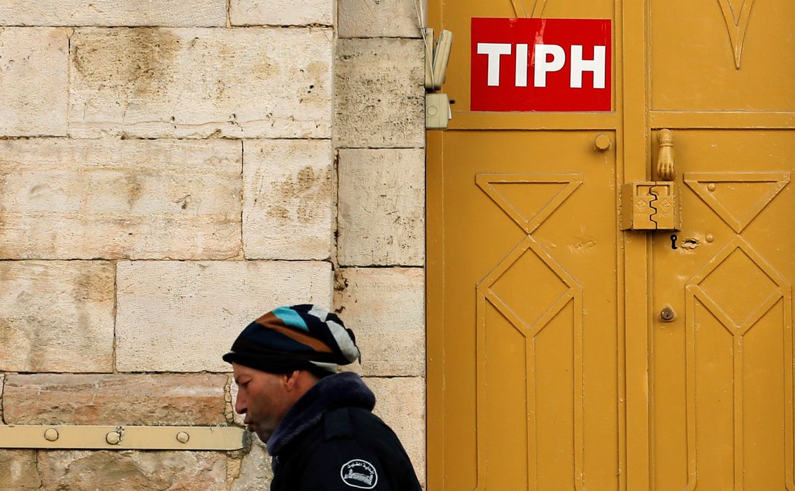 A sign of the Temporary International Presence in Hebron (TIPH) is seen on its office in Hebron, in the Israeli-occupied West Bank January 29, 2019. REUTERS/Mussa Qawasma A sign of the Temporary International Presence in Hebron (TIPH) is seen on its office in Hebron, in the Israeli-occupied West Bank January 29, 2019. REUTERS/Mussa Qawasma
