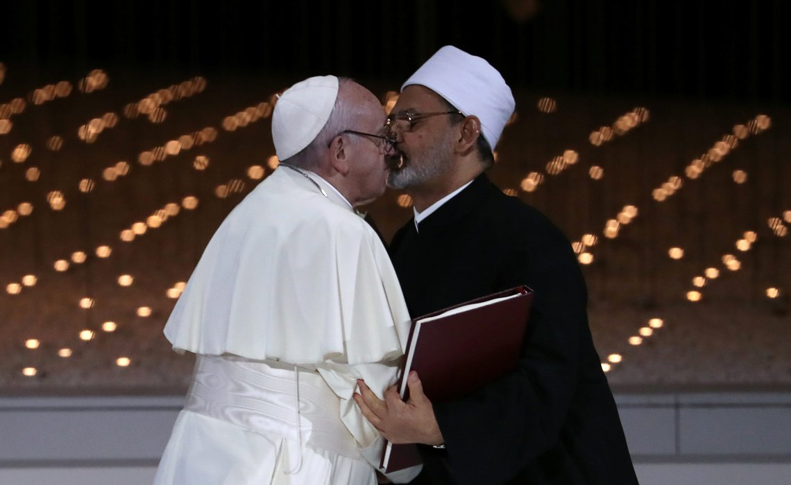 Pope Francis and Grand Imam of al-Azhar Sheikh Ahmed al-Tayeb kiss each other after signing a document on fighting extremism, during an inter-religious meeting at the Founder's Memorial in Abu Dhabi, United Arab Emirates, February 4, 2019. REUTERS/Tony Gentile Pope Francis and Grand Imam of al-Azhar Sheikh Ahmed al-Tayeb kiss each other after signing a document on fighting extremism, during an inter-religious meeting at the Founder's Memorial in Abu Dhabi, United Arab Emirates, February 4, 2019. REUTERS/Tony Gentile