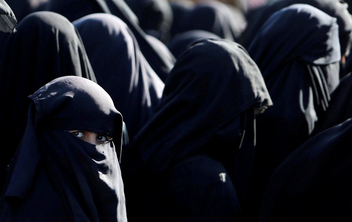 Women stand together al-Hol displacement camp in Hasaka governorate, Syria, April 2, 2019. Picture taken April 2, 2019. REUTERS/Ali Hashisho TPX IMAGES OF THE DAY Women stand together al-Hol displacement camp in Hasaka governorate, Syria, April 2, 2019. Picture taken April 2, 2019. REUTERS/Ali Hashisho TPX IMAGES OF THE DAY