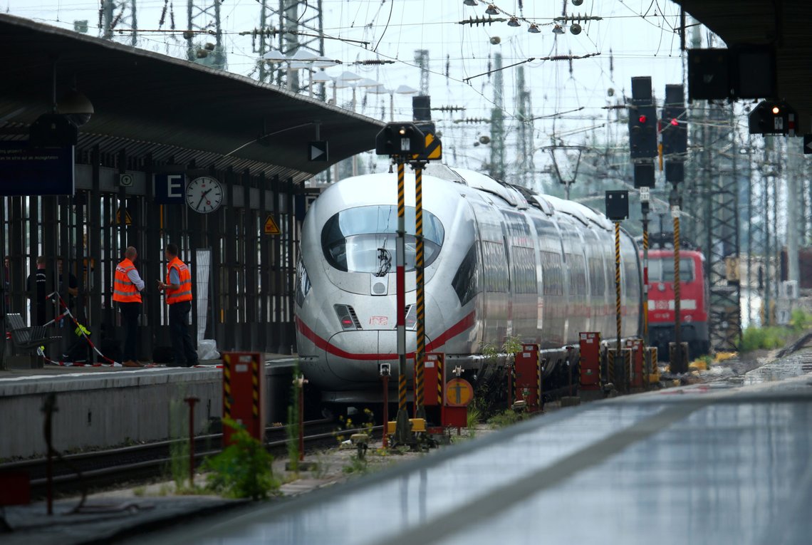 Officials walk on a platform at the main train station in Frankfurt, Germany, July 29, 2019, after a 40-year-old man of African origin pushed an eight-year-old boy in front of an oncoming train, killing him, police said. REUTERS/Ralph Orlowski Officials walk on a platform at the main train station in Frankfurt, Germany, July 29, 2019, after a 40-year-old man of African origin pushed an eight-year-old boy in front of an oncoming train, killing him, police said. REUTERS/Ralph Orlowski