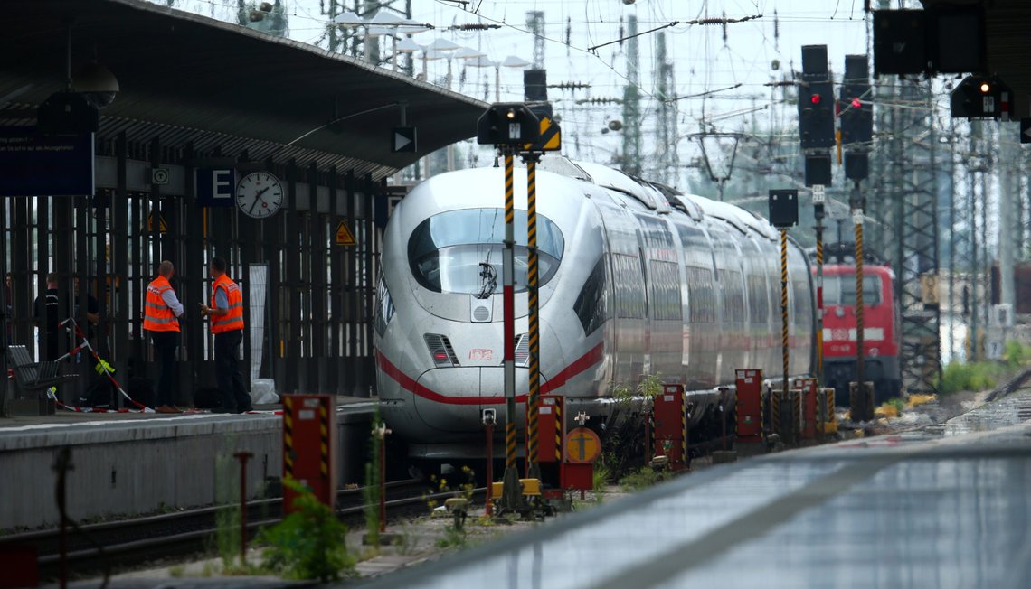 Officials walk on a platform at the main train station in Frankfurt, Germany, July 29, 2019, after a 40-year-old man of African origin pushed an eight-year-old boy in front of an oncoming train, killing him, police said. REUTERS/Ralph Orlowski Officials walk on a platform at the main train station in Frankfurt, Germany, July 29, 2019, after a 40-year-old man of African origin pushed an eight-year-old boy in front of an oncoming train, killing him, police said. REUTERS/Ralph Orlowski