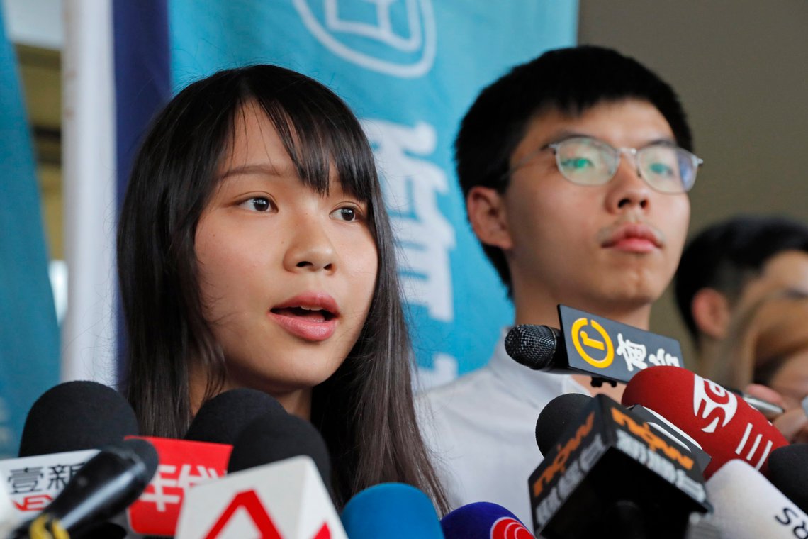 Pro-democracy activists Joshua Wong, right, and Agnes Chow speak to media outside a district court in Hong Kong, Friday, Aug. 30, 2019. Wong and Chow were granted bail Friday after being charged with inciting people to join a protest in June, while authorities denied permission for a major march in what appears to be a harder line on this summer's protests. (AP Photo/Kin Cheung) Pro-democracy activists Joshua Wong, right, and Agnes Chow speak to media outside a district court in Hong Kong, Friday, Aug. 30, 2019. Wong and Chow were granted bail Friday after being charged with inciting people to join a protest in June, while authorities denied permission for a major march in what appears to be a harder line on this summer's protests. (AP Photo/Kin Cheung)