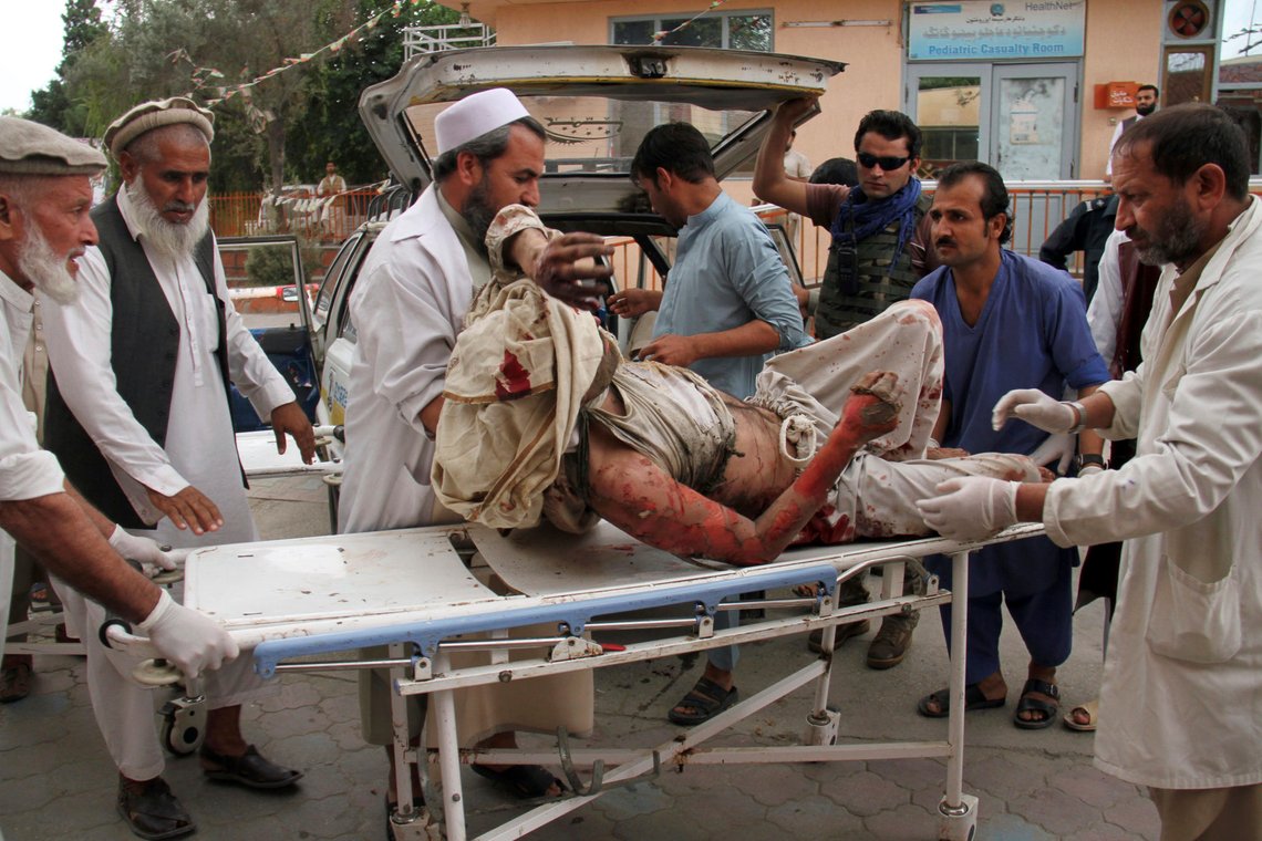 A wounded man is brought by stretcher into a hospital after a mortar was fired by insurgents in Haskamena district of Jalalabad east of Kabul, Afghanistan, Friday, Oct. 18, 2019. An Afghan official says at least several people have been killed during Friday prayers when a mortar fired by insurgents blasted through the roof of a mosque. (AP Photo/Wali Sabawoon) A wounded man is brought by stretcher into a hospital after a mortar was fired by insurgents in Haskamena district of Jalalabad east of Kabul, Afghanistan, Friday, Oct. 18, 2019. An Afghan official says at least several people have been killed during Friday prayers when a mortar fired by insurgents blasted through the roof of a mosque. (AP Photo/Wali Sabawoon)