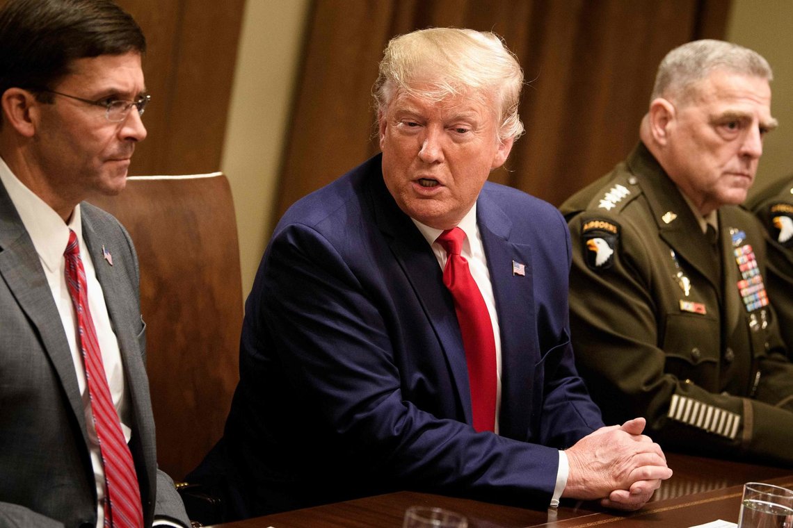 (FILES) In this file photo taken on October 7, 2019 US Secretary of Defense Mark Esper (L) and Chairman of the Joint Chiefs of Staff Army General Mark A. Milley (R) listen while US President Donald Trump speaks before a meeting with senior military leaders in the Cabinet Room of the White House in Washington DC. - US Defense Secretary Mark Esper said October 13, 2019 the Pentagon would cooperate with the congressional impeachment inquiry -- in an apparent break with President Donald Trump's policy to thwart the probe. Esper said his department would try to comply with a subpoena from House Democrats seeking records relating to the withholding of US military aid to Ukraine. (Photo by Brendan Smialowski / AFP) (FILES) In this file photo taken on October 7, 2019 US Secretary of Defense Mark Esper (L) and Chairman of the Joint Chiefs of Staff Army General Mark A. Milley (R) listen while US President Donald Trump speaks before a meeting with senior military leaders in the Cabinet Room of the White House in Washington DC. - US Defense Secretary Mark Esper said October 13, 2019 the Pentagon would cooperate with the congressional impeachment inquiry -- in an apparent break with President Donald Trump's policy to thwart the probe. Esper said his department would try to comply with a subpoena from House Democrats seeking records relating to the withholding of US military aid to Ukraine. (Photo by Brendan Smialowski / AFP)