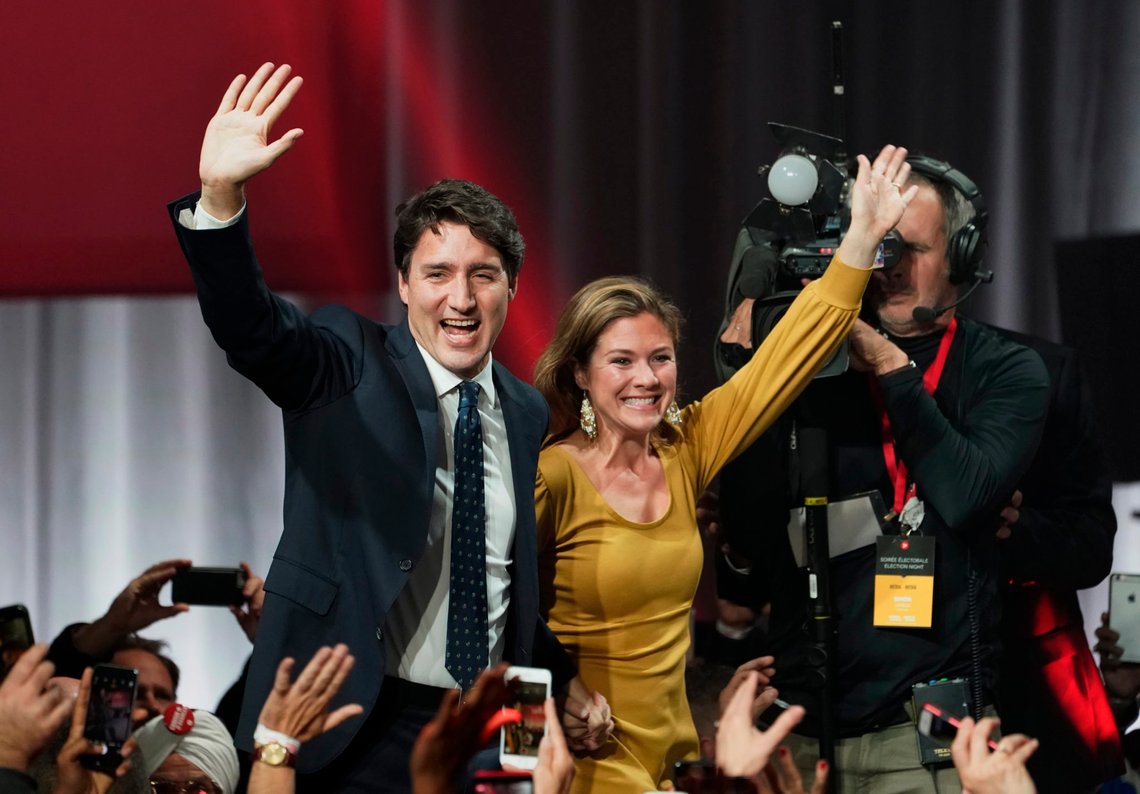 Liberal leader Justin Trudeau and wife Sophie Gregoire Trudeau wave as they go on stage at Liberal election headquarters in Montreal, Monday, Oct. 21, 2019. (Paul Chiasson/The Canadian Press via AP) Liberal leader Justin Trudeau and wife Sophie Gregoire Trudeau wave as they go on stage at Liberal election headquarters in Montreal, Monday, Oct. 21, 2019. (Paul Chiasson/The Canadian Press via AP)