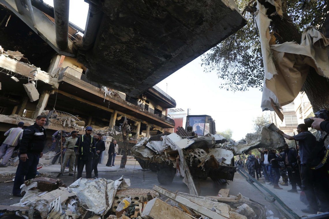 A picture taken on November 12, 2019, shows Syrian municipality workers clearing debris from building in Damascus' Mazze neighbourhood following an air strike. - Syrian state media reported that an Israeli strike hit the home of another Islamic Jihad militant, killing his son and another person. Israel did not immediately comment on that strike. Israel's military killed a commander of Palestinian militant group Islamic Jihad in a strike on his home in the Gaza Strip early, prompting retaliatory rocket fire and fears of a severe escalation in violence. (Photo by LOUAI BESHARA / AFP) A picture taken on November 12, 2019, shows Syrian municipality workers clearing debris from building in Damascus' Mazze neighbourhood following an air strike. - Syrian state media reported that an Israeli strike hit the home of another Islamic Jihad militant, killing his son and another person. Israel did not immediately comment on that strike. Israel's military killed a commander of Palestinian militant group Islamic Jihad in a strike on his home in the Gaza Strip early, prompting retaliatory rocket fire and fears of a severe escalation in violence. (Photo by LOUAI BESHARA / AFP)