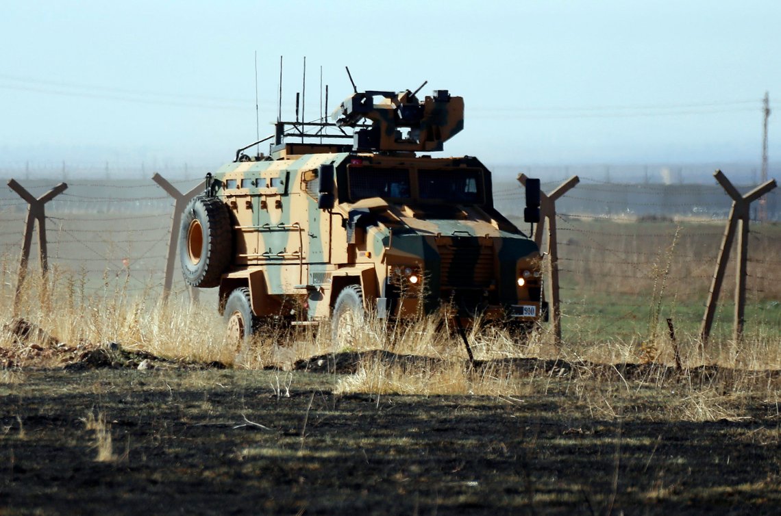 In this photo taken from the outskirts of the village of Alakamis, in Idil province, southeastern Turkey, a Turkish army vehicles is driven in Turkey after conducting a joint patrol with Russian forces in Syria, Friday, Nov. 8, 2019. The Britain-based Syrian Observatory for Human Rights says a protester has been killed when he was run over in the village of Sarmasakh, Syria near the border by a Turkish vehicle during a joint patrol with Russia.The man was among residents who pelted with shoes and stones Turkish and Russian troops who were conducting their third joint patrol in northeastern Syria, under a cease-fire deal brokered by Moscow that forced Kurdish fighters to withdraw from areas bordering Turkey. (AP Photo/Mehmet Guzel) In this photo taken from the outskirts of the village of Alakamis, in Idil province, southeastern Turkey, a Turkish army vehicles is driven in Turkey after conducting a joint patrol with Russian forces in Syria, Friday, Nov. 8, 2019. The Britain-based Syrian Observatory for Human Rights says a protester has been killed when he was run over in the village of Sarmasakh, Syria near the border by a Turkish vehicle during a joint patrol with Russia.The man was among residents who pelted with shoes and stones Turkish and Russian troops who were conducting their third joint patrol in northeastern Syria, under a cease-fire deal brokered by Moscow that forced Kurdish fighters to withdraw from areas bordering Turkey. (AP Photo/Mehmet Guzel)