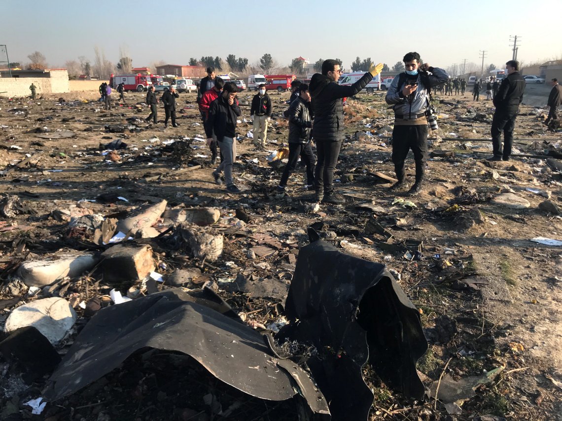 People check the debris from a plane crash belonging to Ukraine International Airlines after take-off from Iran's Imam Khomeini airport, on the outskirts of Tehran, Iran January 8, 2020. Nazanin Tabatabaee/WANA (West Asia News Agency) via REUTERS ATTENTION EDITORS - THIS IMAGE HAS BEEN SUPPLIED BY A THIRD PARTY People check the debris from a plane crash belonging to Ukraine International Airlines after take-off from Iran's Imam Khomeini airport, on the outskirts of Tehran, Iran January 8, 2020. Nazanin Tabatabaee/WANA (West Asia News Agency) via REUTERS ATTENTION EDITORS - THIS IMAGE HAS BEEN SUPPLIED BY A THIRD PARTY