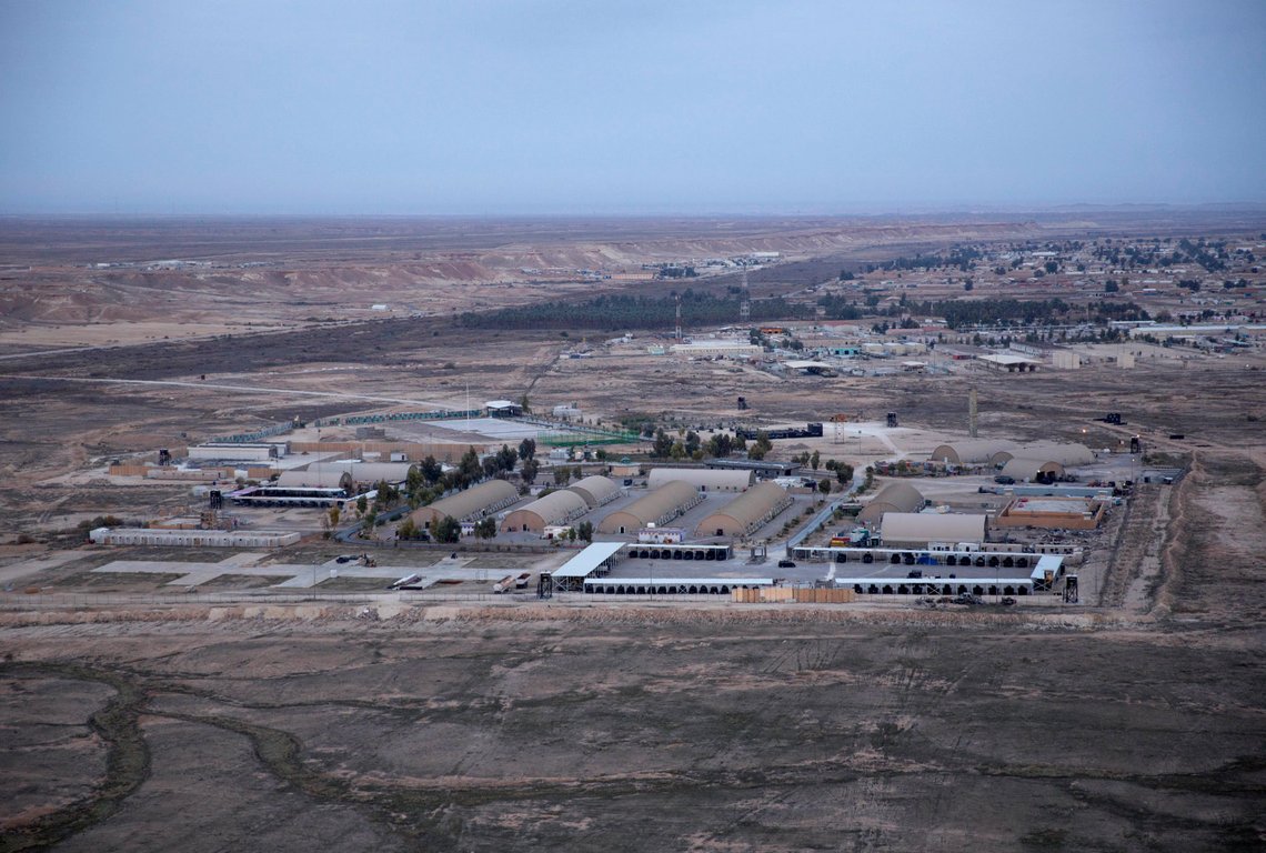 This aerial photo taken from a helicopter shows Ain al-Asad air base in the western Anbar desert, Iraq, Sunday, Dec. 29, 2019. An Iraqi general said Sunday that security has been beefed up around the Ain al-Asad air base, a sprawling complex that hosts U.S. forces, following a series of attacks. (AP Photo/Nasser Nasser) This aerial photo taken from a helicopter shows Ain al-Asad air base in the western Anbar desert, Iraq, Sunday, Dec. 29, 2019. An Iraqi general said Sunday that security has been beefed up around the Ain al-Asad air base, a sprawling complex that hosts U.S. forces, following a series of attacks. (AP Photo/Nasser Nasser)