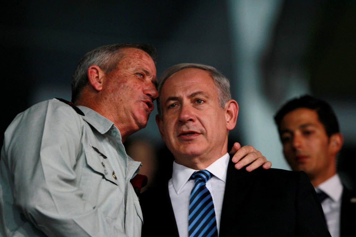 Israel's Prime Minister Benjamin Netanyahu (R) and Israel's armed forces chief Major-General Benny Gantz speak during the opening ceremony of the 19th Maccabiah Games at Teddy Stadium in Jerusalem July 18, 2013. REUTERS/Baz Ratner Israel's Prime Minister Benjamin Netanyahu (R) and Israel's armed forces chief Major-General Benny Gantz speak during the opening ceremony of the 19th Maccabiah Games at Teddy Stadium in Jerusalem July 18, 2013. REUTERS/Baz Ratner