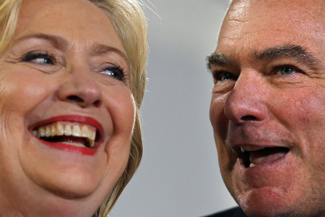 Democratic U.S. presidential candidate Hillary Clinton and U.S. Senator Tim Kaine (D-VA) react during a campaign rally at Ernst Community Cultural Center in Annandale, Virginia, U.S., July 14, 2016. Picture taken July 14, 2016. REUTERS/Carlos Barria Democratic U.S. presidential candidate Hillary Clinton and U.S. Senator Tim Kaine (D-VA) react during a campaign rally at Ernst Community Cultural Center in Annandale, Virginia, U.S., July 14, 2016. Picture taken July 14, 2016. REUTERS/Carlos Barria
