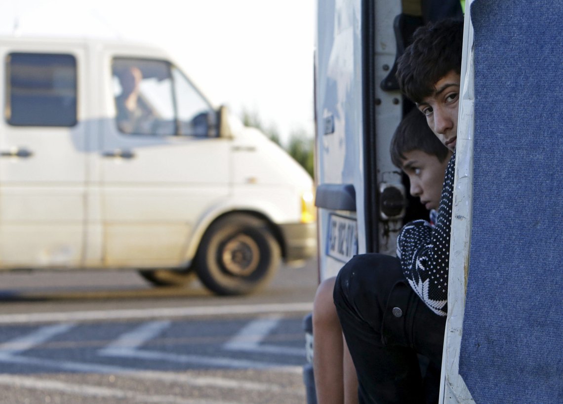 Migrants sit inside a van after being pulled over by police on the highway near Gyor, Hungary, September 6, 2015. After days of confrontation and chaos, Hungary deployed more than 100 buses overnight to take thousands of the migrants who had streamed there from southeast Europe to the Austrian frontier. Austria said it had agreed with Germany to allow the migrants access, waiving the asylum rules. REUTERS/David W Cerny Migrants sit inside a van after being pulled over by police on the highway near Gyor, Hungary, September 6, 2015. After days of confrontation and chaos, Hungary deployed more than 100 buses overnight to take thousands of the migrants who had streamed there from southeast Europe to the Austrian frontier. Austria said it had agreed with Germany to allow the migrants access, waiving the asylum rules. REUTERS/David W Cerny