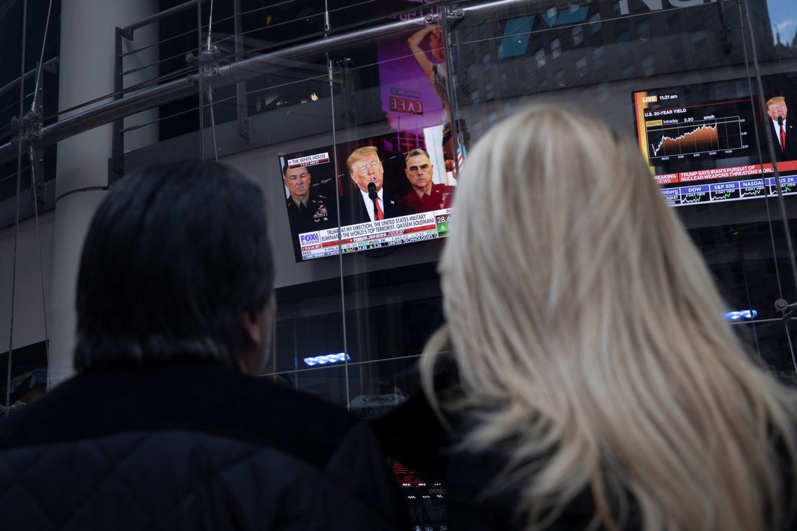 People watch as U.S. President Donald Trump is seen on screens delivering a statement from the White House after Iran launched missile attacks on U.S.-led forces in Iraq, in Times Square in New York, U.S., January 8, 2020. REUTERS/Mike Segar People watch as U.S. President Donald Trump is seen on screens delivering a statement from the White House after Iran launched missile attacks on U.S.-led forces in Iraq, in Times Square in New York, U.S., January 8, 2020. REUTERS/Mike Segar