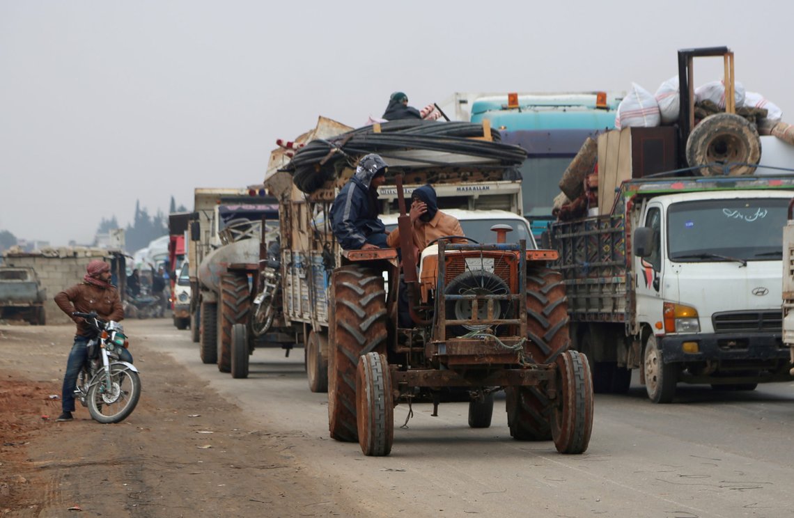 FILE PHOTO: Trucks carry belongings of people fleeing from Maarat al-Numan, in northern Idlib, Syria December 24, 2019. REUTERS/Mahmoud Hassano/File Photo FILE PHOTO: Trucks carry belongings of people fleeing from Maarat al-Numan, in northern Idlib, Syria December 24, 2019. REUTERS/Mahmoud Hassano/File Photo