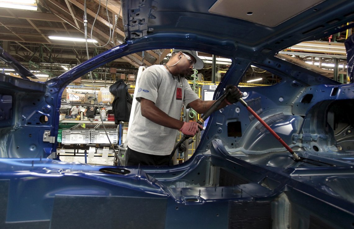 A Ford Motor assembly worker works on the frame of a 2015 Ford Mustang vehicle at the Ford Motor Flat Rock Assembly Plant in Flat Rock, Michigan, August 20, 2015. REUTERS/Rebecca Cook A Ford Motor assembly worker works on the frame of a 2015 Ford Mustang vehicle at the Ford Motor Flat Rock Assembly Plant in Flat Rock, Michigan, August 20, 2015. REUTERS/Rebecca Cook