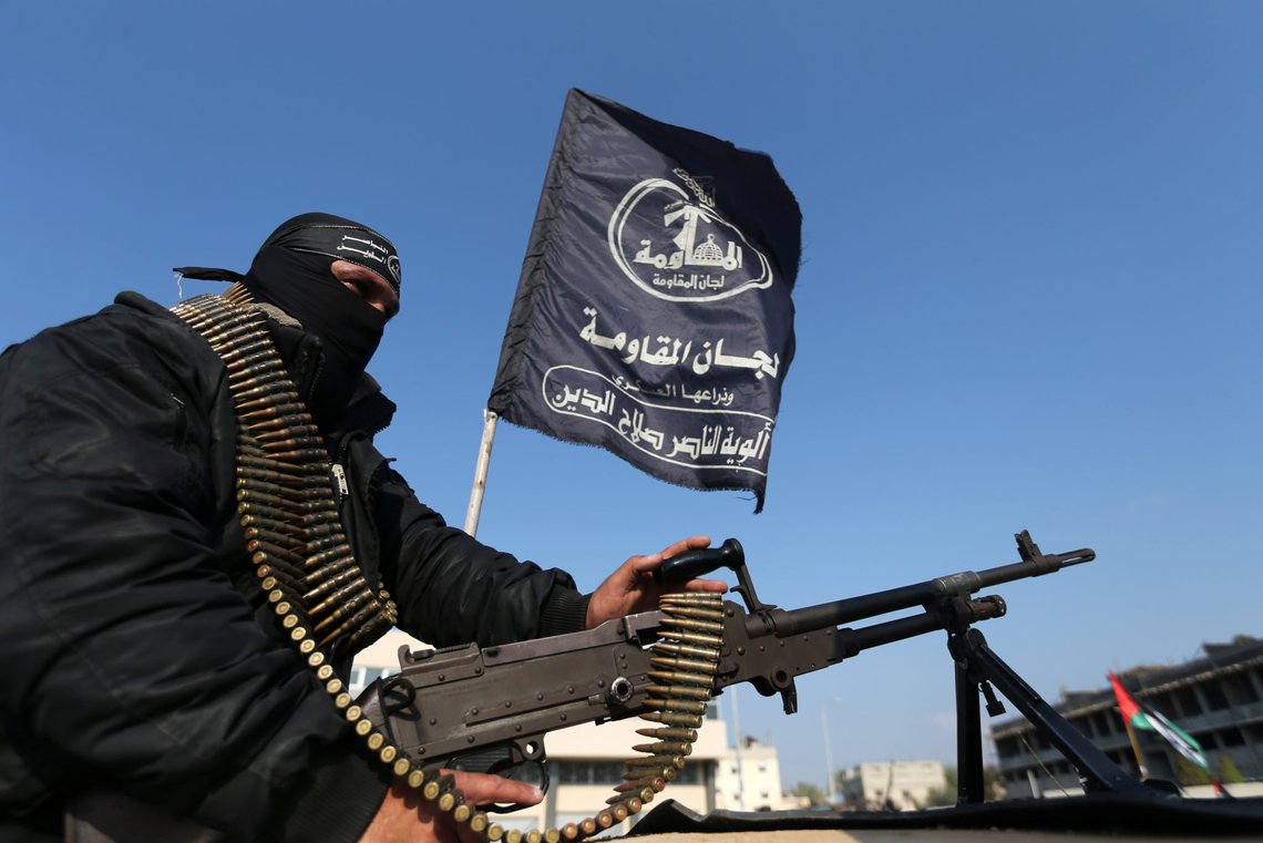 A Palestinian militant of the Al-Nasser Saladin Brigades holds a weapon as he rides on a pick-up truck during an anti-Israel military show in Khan Younis in the southern Gaza Strip February 17, 2020. REUTERS/Ibraheem Abu Mustafa A Palestinian militant of the Al-Nasser Saladin Brigades holds a weapon as he rides on a pick-up truck during an anti-Israel military show in Khan Younis in the southern Gaza Strip February 17, 2020. REUTERS/Ibraheem Abu Mustafa