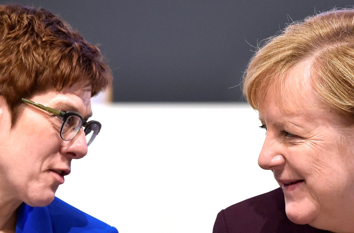 FILE PHOTO: German Chancellor Angela Merkel talks to party chairwoman Annegret Kramp-Karrenbauer during the Christian Democratic Union (CDU) party congress in Leipzig, Germany, November 22, 2019. REUTERS/Matthias Rietschel/File Photo FILE PHOTO: German Chancellor Angela Merkel talks to party chairwoman Annegret Kramp-Karrenbauer during the Christian Democratic Union (CDU) party congress in Leipzig, Germany, November 22, 2019. REUTERS/Matthias Rietschel/File Photo