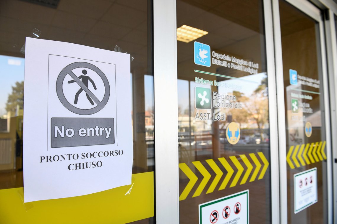 FILE PHOTO: A 'no entry' sign advising that the emergency room is closed is seen on the main entrance of the Codogno hospital amid a coronavirus outbreak in northern Italy, February 22, 2020. To match Special Report HEALTH-CORONAVIRUS/RESPONSE REUTERS/Flavio Lo Scalzo/File Photo FILE PHOTO: A 'no entry' sign advising that the emergency room is closed is seen on the main entrance of the Codogno hospital amid a coronavirus outbreak in northern Italy, February 22, 2020. To match Special Report HEALTH-CORONAVIRUS/RESPONSE REUTERS/Flavio Lo Scalzo/File Photo