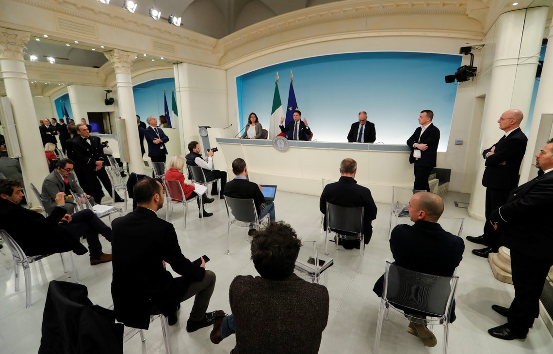 Italian Prime Minister Giuseppe Conte speaks in a news conference room of Palazzo Chigi, where chairs are moved one metre apart in order to adhere to restrictions that people are one metre apart, due to coronavirus spread, in Rome, Italy March 11, 2020. REUTERS/Remo Casilli Italian Prime Minister Giuseppe Conte speaks in a news conference room of Palazzo Chigi, where chairs are moved one metre apart in order to adhere to restrictions that people are one metre apart, due to coronavirus spread, in Rome, Italy March 11, 2020. REUTERS/Remo Casilli