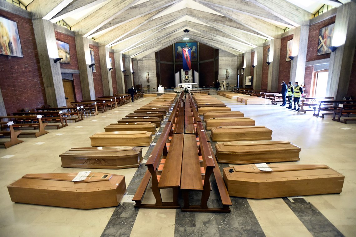Coffins that have been piling up in a church due to a high number of deaths, are seen before they are taken away by military trucks, as Italy struggles to contain a spread of coronavirus disease (COVID-19) before they are taken away by military trucks, in Seriate, Italy March 28, 2020. REUTERS/Flavio Lo Scalzo Coffins that have been piling up in a church due to a high number of deaths, are seen before they are taken away by military trucks, as Italy struggles to contain a spread of coronavirus disease (COVID-19) before they are taken away by military trucks, in Seriate, Italy March 28, 2020. REUTERS/Flavio Lo Scalzo