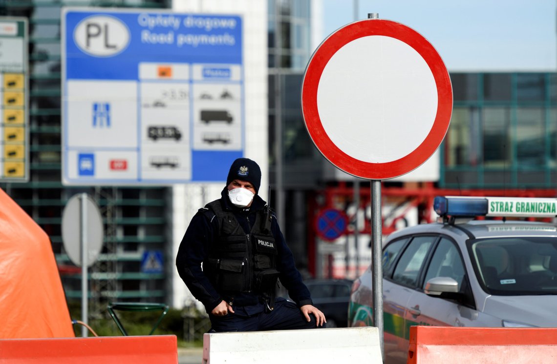 A Polish police officer stands on the Poland-German border crossing point after the Polish government decided to close its borders to foreigners as a preventive measure against the coronavirus (COVID-19) on the city bridge to Slubice, Poland in Frankfurt/Oder, Germany March 15, 2020. REUTERS/Annegret Hilse A Polish police officer stands on the Poland-German border crossing point after the Polish government decided to close its borders to foreigners as a preventive measure against the coronavirus (COVID-19) on the city bridge to Slubice, Poland in Frankfurt/Oder, Germany March 15, 2020. REUTERS/Annegret Hilse