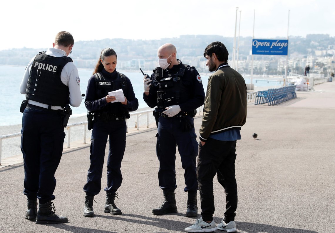 Police officers control a man on the Promenade des Anglais in Nice, as Nice's mayor said on Friday he will be closing a part of it as part of measures to fight the coronavirus (COVID-19) outbreak spread in France, March 20, 2020. REUTERS/Eric Gaillard Police officers control a man on the Promenade des Anglais in Nice, as Nice's mayor said on Friday he will be closing a part of it as part of measures to fight the coronavirus (COVID-19) outbreak spread in France, March 20, 2020. REUTERS/Eric Gaillard