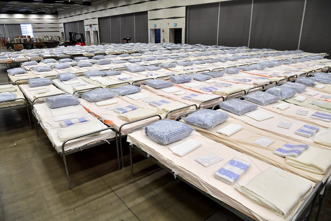 Beds are seen in a field hospital which will provide extra intensive care space for patients with coronavirus disease (COVID-19), inside the exhibition centre Stockholmsmassan in Alvsjo, Stockholm, Sweden March 30, 2020. Jonas Ekstromer/TT News Agency via REUTERS ATTENTION EDITORS - THIS IMAGE WAS PROVIDED BY A THIRD PARTY. SWEDEN OUT. NO COMMERCIAL OR EDITORIAL SALES IN SWEDEN. Beds are seen in a field hospital which will provide extra intensive care space for patients with coronavirus disease (COVID-19), inside the exhibition centre Stockholmsmassan in Alvsjo, Stockholm, Sweden March 30, 2020. Jonas Ekstromer/TT News Agency via REUTERS ATTENTION EDITORS - THIS IMAGE WAS PROVIDED BY A THIRD PARTY. SWEDEN OUT. NO COMMERCIAL OR EDITORIAL SALES IN SWEDEN.