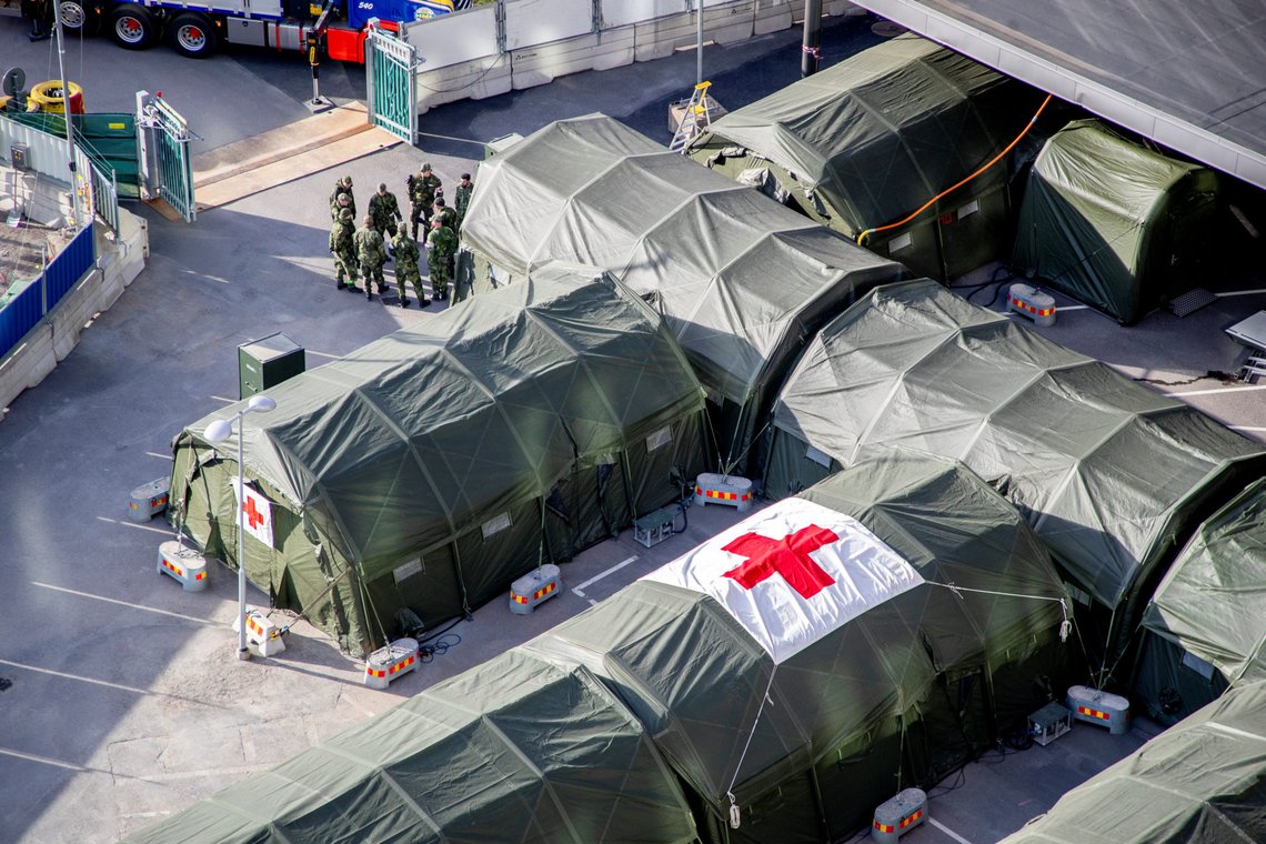 A general view of a field hospital being prepared at the Ostra Sjukhuset hospital area, amid the spread of the coronavirus disease (COVID-19), in Gothenburg, Sweden March 24, 2020. Adam Ihse/TT News Agency/via REUTERS ATTENTION EDITORS - THIS IMAGE WAS PROVIDED BY A THIRD PARTY. SWEDEN OUT. NO COMMERCIAL OR EDITORIAL SALES IN SWEDEN. A general view of a field hospital being prepared at the Ostra Sjukhuset hospital area, amid the spread of the coronavirus disease (COVID-19), in Gothenburg, Sweden March 24, 2020. Adam Ihse/TT News Agency/via REUTERS ATTENTION EDITORS - THIS IMAGE WAS PROVIDED BY A THIRD PARTY. SWEDEN OUT. NO COMMERCIAL OR EDITORIAL SALES IN SWEDEN.