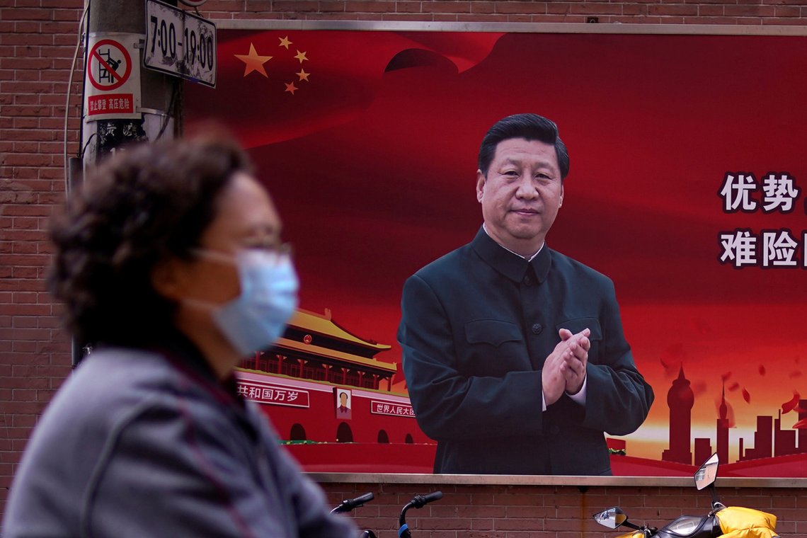 A woman wearing a protective mask is seen past a portrait of Chinese President Xi Jinping on a street as the country is hit by an outbreak of the coronavirus, in Shanghai, China March 12, 2020. REUTERS/Aly Song A woman wearing a protective mask is seen past a portrait of Chinese President Xi Jinping on a street as the country is hit by an outbreak of the coronavirus, in Shanghai, China March 12, 2020. REUTERS/Aly Song