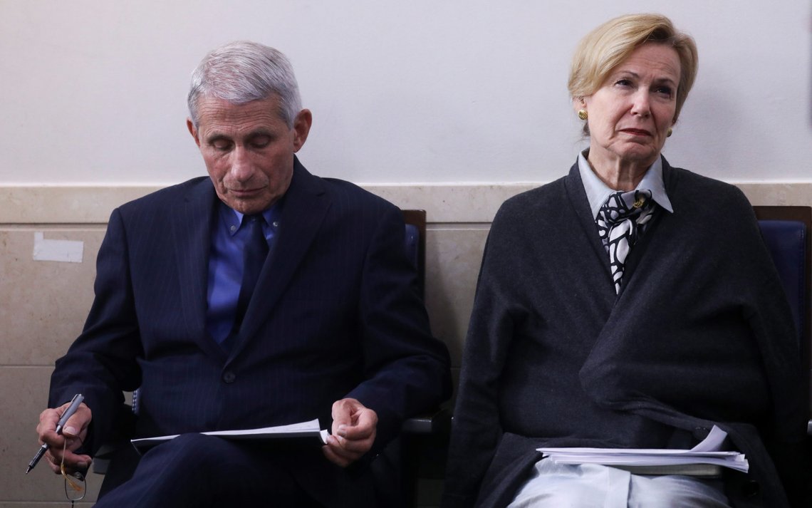White House medical advisors Dr. Anthony Fauci and Dr. Deborah Birx listen as U.S. President Donald Trump addresses the daily coronavirus task force briefing at the White House in Washington, U.S., April 17, 2020. REUTERS/Leah Millis White House medical advisors Dr. Anthony Fauci and Dr. Deborah Birx listen as U.S. President Donald Trump addresses the daily coronavirus task force briefing at the White House in Washington, U.S., April 17, 2020. REUTERS/Leah Millis