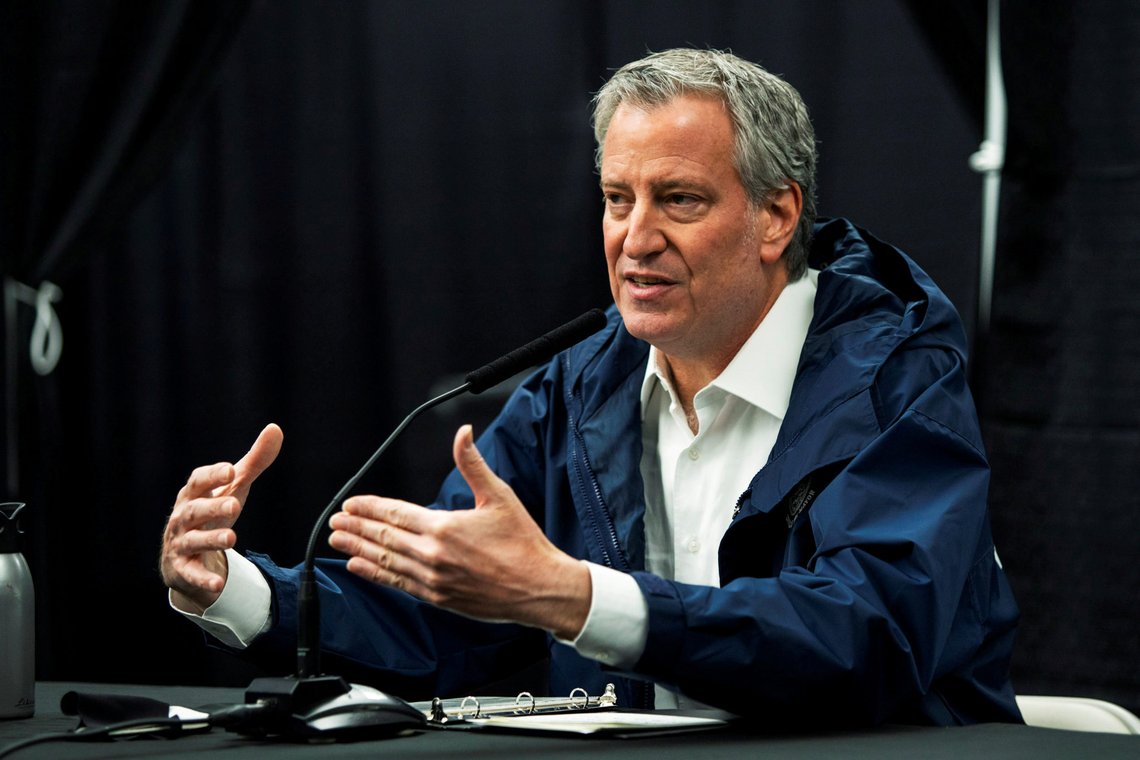 FILE PHOTO: New York City Mayor Bill De Blasio speaks to the media during a press conference in temporary hospital located at the USTA Billie Jean King National Tennis Center as the outbreak of the coronavirus disease (COVID-19) continues in the Queens borough of New York City, New York, U.S., April 10, 2020. REUTERS/Eduardo Munoz/File Photo FILE PHOTO: New York City Mayor Bill De Blasio speaks to the media during a press conference in temporary hospital located at the USTA Billie Jean King National Tennis Center as the outbreak of the coronavirus disease (COVID-19) continues in the Queens borough of New York City, New York, U.S., April 10, 2020. REUTERS/Eduardo Munoz/File Photo