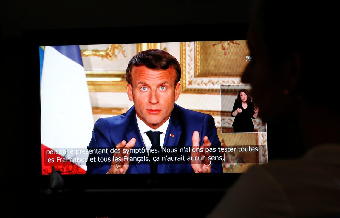 French President Emmanuel Macron is seen as he addresses the nation about the coronavirus disease (COVID-19) outbreak, on a television screen from confined people in Vertou, France, April 13, 2020. REUTERS/Stephane Mahe French President Emmanuel Macron is seen as he addresses the nation about the coronavirus disease (COVID-19) outbreak, on a television screen from confined people in Vertou, France, April 13, 2020. REUTERS/Stephane Mahe