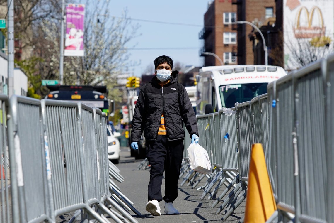 A man walks between barricades set up outside Elmhurst Hospital during the outbreak of the coronavirus disease (COVID-19) in the Queens borough of New York City, New York, U.S., April 6, 2020. REUTERS/Eduardo Munoz A man walks between barricades set up outside Elmhurst Hospital during the outbreak of the coronavirus disease (COVID-19) in the Queens borough of New York City, New York, U.S., April 6, 2020. REUTERS/Eduardo Munoz