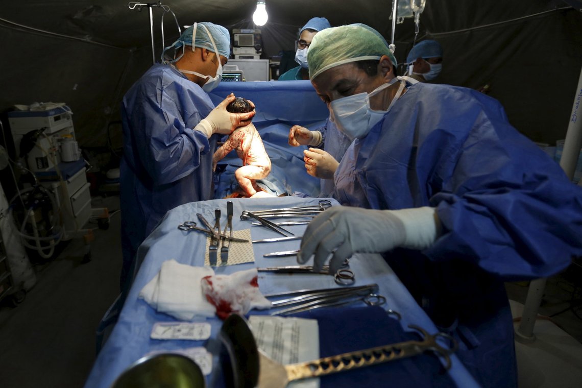 Moroccan doctors carry a Syrian baby Siwar, who was born by caesarean section in a field hospital in Al Zaatari refugee camp in the Jordanian city of Mafraq, near the border with Syria, March 7, 2016. Siwar is the third child of a Syrian family from Daraa who fled to Jordan two years ago. She is their second child to be born in the camp. Since the beginning of the Syrian crisis, 50-80 Syrian children were born in the Zaatari refugee camp each week, according to the official website of UNHCR. REUTERS/ Muhammad Hamed SEARCH HAMED BORN FOR THIS STORY. SEARCH THE WIDER IMAGE FOR ALL STORIES Moroccan doctors carry a Syrian baby Siwar, who was born by caesarean section in a field hospital in Al Zaatari refugee camp in the Jordanian city of Mafraq, near the border with Syria, March 7, 2016. Siwar is the third child of a Syrian family from Daraa who fled to Jordan two years ago. She is their second child to be born in the camp. Since the beginning of the Syrian crisis, 50-80 Syrian children were born in the Zaatari refugee camp each week, according to the official website of UNHCR. REUTERS/ Muhammad Hamed SEARCH HAMED BORN FOR THIS STORY. SEARCH THE WIDER IMAGE FOR ALL STORIES