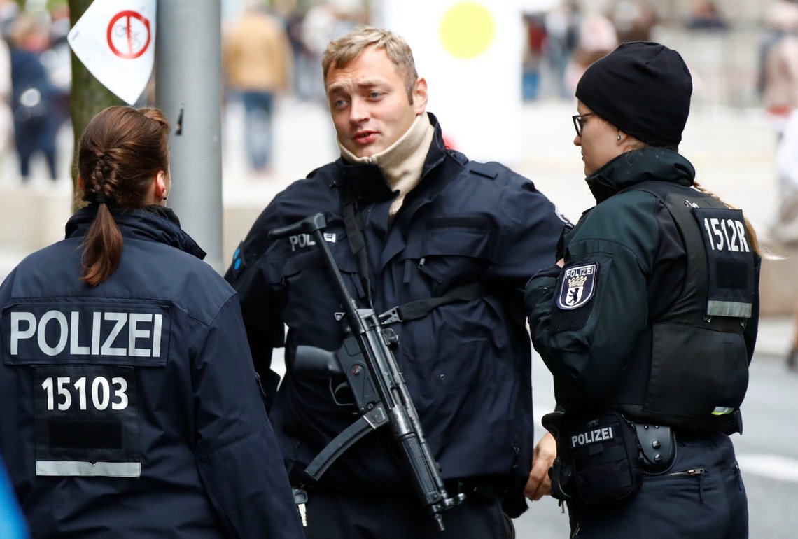 Police is seen during German Unification Day celebrations at the Brandenburg Gate in Berlin, Germany, October 3, 2018. REUTERS/Fabrizio Bensch Police is seen during German Unification Day celebrations at the Brandenburg Gate in Berlin, Germany, October 3, 2018. REUTERS/Fabrizio Bensch