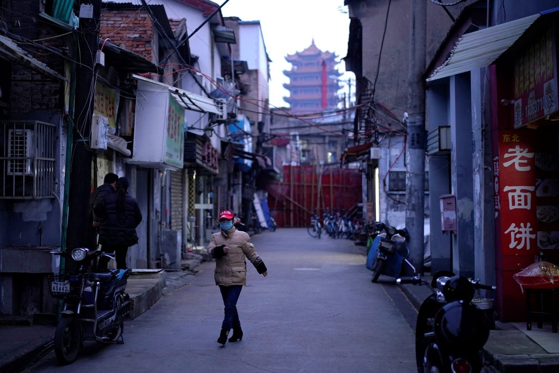 A resident wearing a face mask dances at a blocked residential area after the lockdown was lifted in Wuhan, capital of Hubei province and China's epicentre of the novel coronavirus disease (COVID-19) outbreak, April 11, 2020. REUTERS/Aly Song A resident wearing a face mask dances at a blocked residential area after the lockdown was lifted in Wuhan, capital of Hubei province and China's epicentre of the novel coronavirus disease (COVID-19) outbreak, April 11, 2020. REUTERS/Aly Song