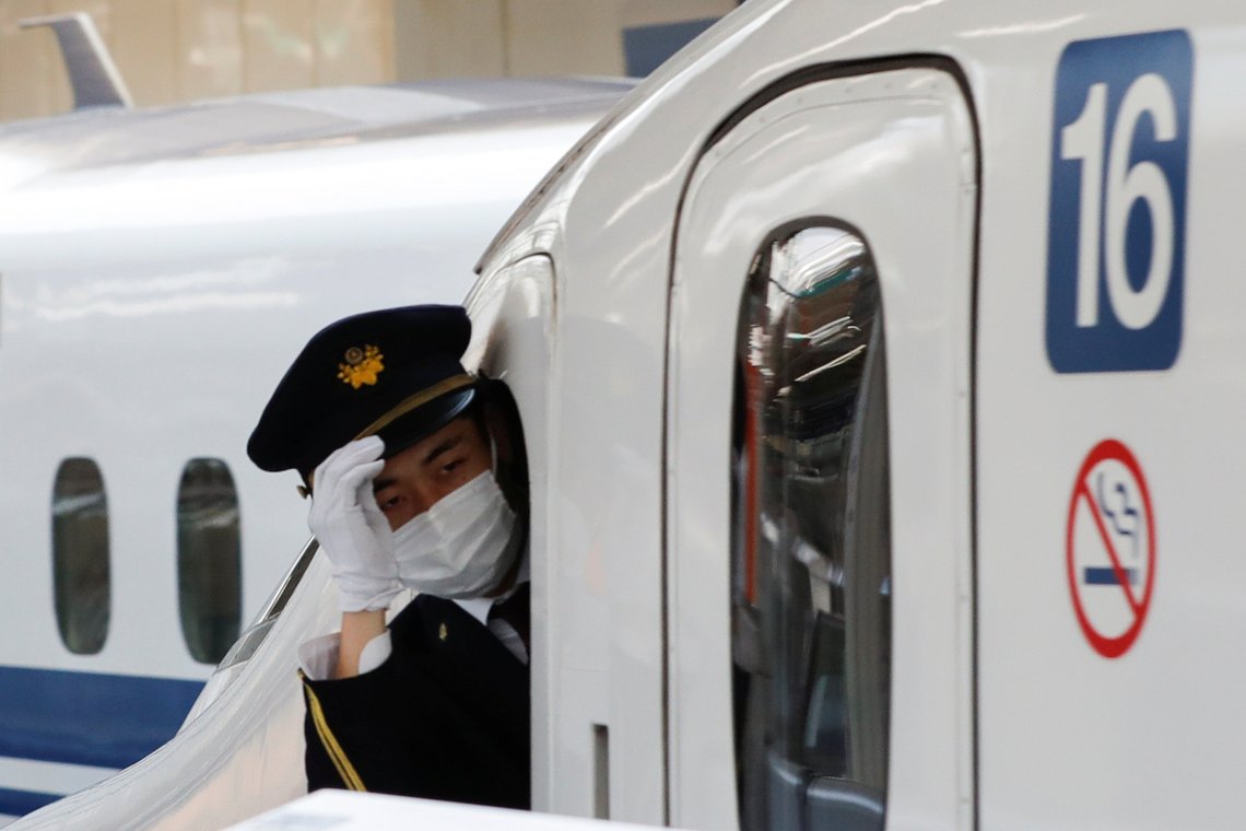 A train staff member wearing a protective face mask is seen on a train on Tokyo station where fewer people than usual are seen during Golden Week holidays following the coronavirus disease (COVID-19) outbreak, in Tokyo, Japan, April 29, 2020.REUTERS/Kim Kyung-Hoon A train staff member wearing a protective face mask is seen on a train on Tokyo station where fewer people than usual are seen during Golden Week holidays following the coronavirus disease (COVID-19) outbreak, in Tokyo, Japan, April 29, 2020.REUTERS/Kim Kyung-Hoon