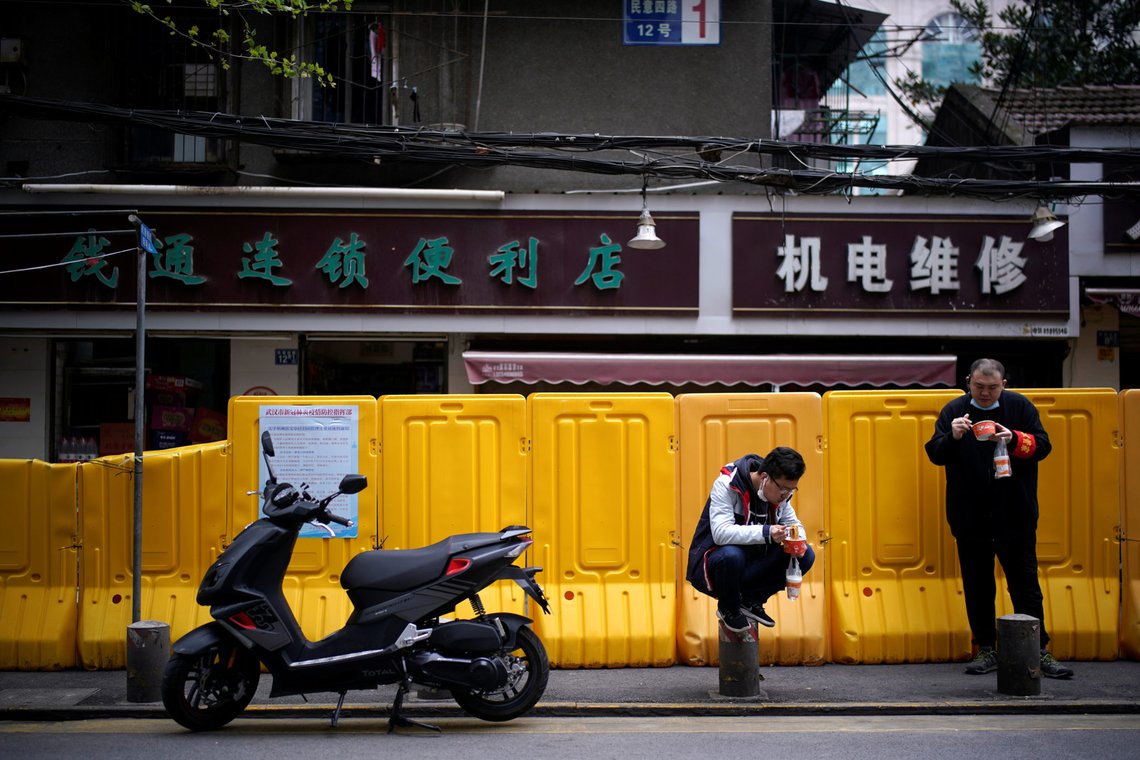 People wearing face masks eat “Regan Noodle”, Wuhan’s signature hot dried noodles, for breakfast at a residential area blocked by barriers in Wuhan, Hubei province, the epicentre of China's coronavirus disease (COVID-19) outbreak, April 2, 2020. REUTERS/Aly Song People wearing face masks eat “Regan Noodle”, Wuhan’s signature hot dried noodles, for breakfast at a residential area blocked by barriers in Wuhan, Hubei province, the epicentre of China's coronavirus disease (COVID-19) outbreak, April 2, 2020. REUTERS/Aly Song