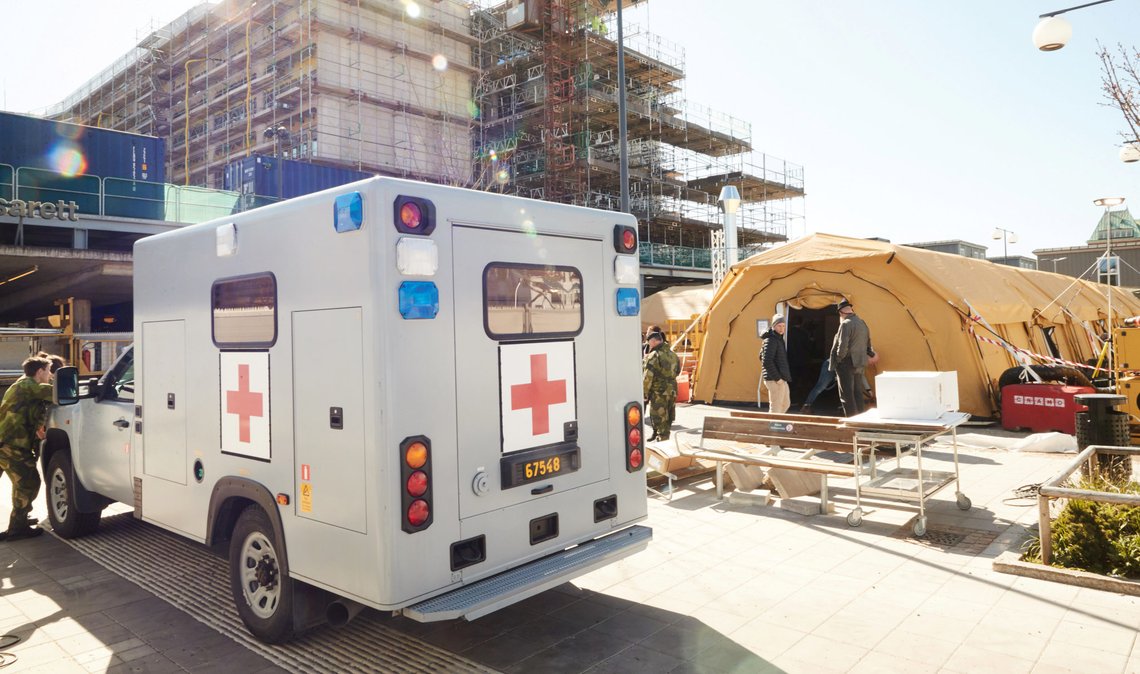 An ambulance lent by the Swedish Armed Forces to transfer the intensive care patients infected with the coronavirus disease (COVID-19) between the hospitals are pictured in Helsingborg, Sweden April 09, 2020. Andreas Hillergren/TT News Agency/via REUTERS ATTENTION EDITORS - THIS IMAGE WAS PROVIDED BY A THIRD PARTY. SWEDEN OUT. NO COMMERCIAL OR EDITORIAL SALES IN SWEDEN. An ambulance lent by the Swedish Armed Forces to transfer the intensive care patients infected with the coronavirus disease (COVID-19) between the hospitals are pictured in Helsingborg, Sweden April 09, 2020. Andreas Hillergren/TT News Agency/via REUTERS ATTENTION EDITORS - THIS IMAGE WAS PROVIDED BY A THIRD PARTY. SWEDEN OUT. NO COMMERCIAL OR EDITORIAL SALES IN SWEDEN.