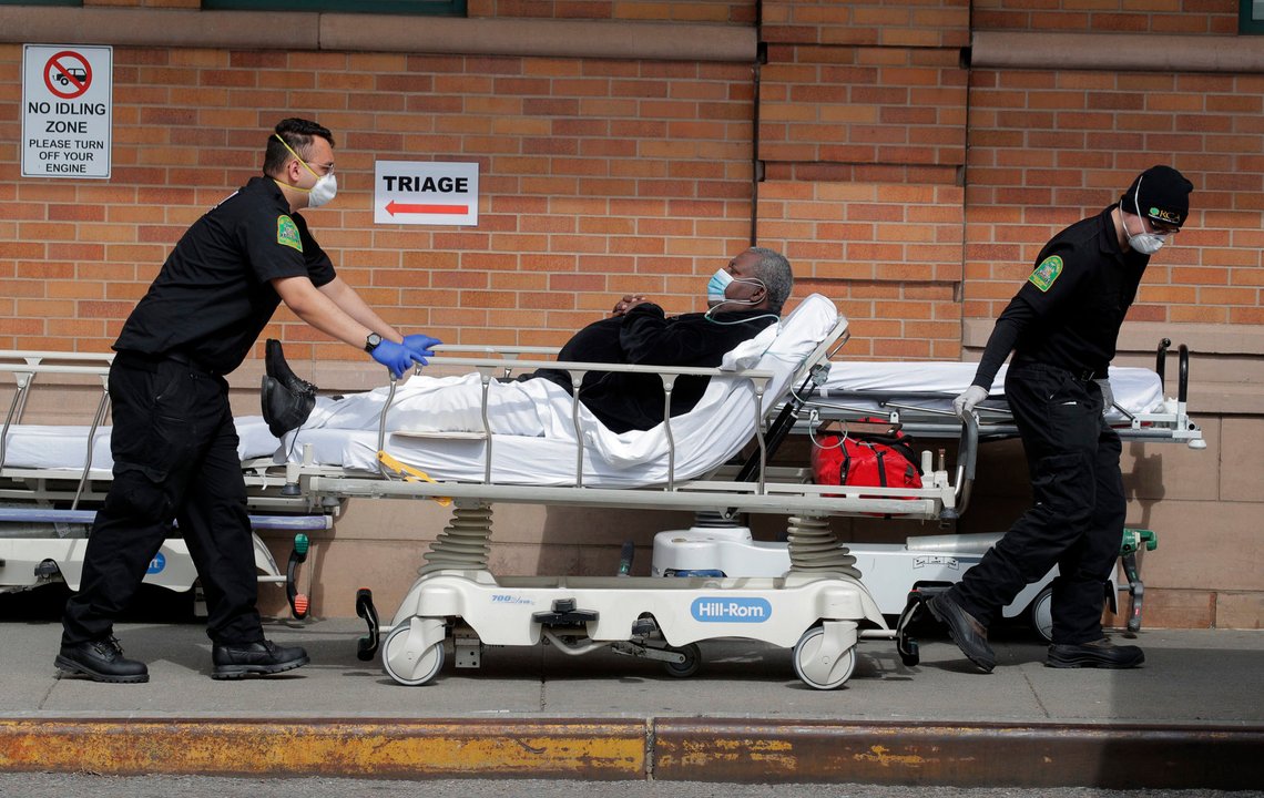 Paramedics take a patient into emergency center during the outbreak of the coronavirus disease (COVID-19) in the Brooklyn borough of New York City, New York, U.S., April 7, 2020. REUTERS/Brendan Mcdermid Paramedics take a patient into emergency center during the outbreak of the coronavirus disease (COVID-19) in the Brooklyn borough of New York City, New York, U.S., April 7, 2020. REUTERS/Brendan Mcdermid