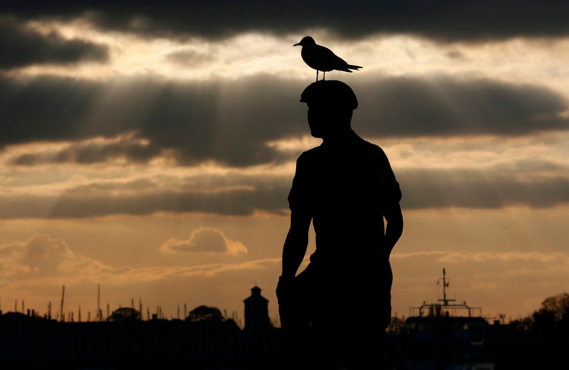 A seagull sits on the 'Mudlarks' sculpture by Michael Peacock during sunset in Portsmouth November 26, 2013. The British shipbuilding industry has been through a turbulent time after defence contractor BAE Systems announced in November that it planned to lay off 1,775 ship workers across the UK. The cuts signal the end of more than 500 years of shipbuilding in Portsmouth on England's south coast. BAE is set to continue constructing ships in Glasgow, but showy entertainment venues, museums and new housing blocks have replaced many of the shipyards that once lined the city?s famous River Clyde. Long gone are the days when the area was an industrial powerhouse producing around a fifth of the world's ships. Now Glasgow promotes itself instead as a financial and commercial hub ? although it still struggles with high unemployment. Picture taken November 26, 2013. REUTERS/Stefan Wermuth (BRITAIN - Tags: BUSINESS EMPLOYMENT SOCIETY ANIMALS)
ATTENTION EDITORS: PICTURE 26 OF 26 FOR PACKAGE 'BRITAIN'S SHIPBUILDING LEGACY'
SEARCH 'WERMUTH SHIPBUILDING' FOR ALL PICTURES PXP01-PXP26 A seagull sits on the 'Mudlarks' sculpture by Michael Peacock during sunset in Portsmouth November 26, 2013. The British shipbuilding industry has been through a turbulent time after defence contractor BAE Systems announced in November that it planned to lay off 1,775 ship workers across the UK. The cuts signal the end of more than 500 years of shipbuilding in Portsmouth on England's south coast. BAE is set to continue constructing ships in Glasgow, but showy entertainment venues, museums and new housing blocks have replaced many of the shipyards that once lined the city?s famous River Clyde. Long gone are the days when the area was an industrial powerhouse producing around a fifth of the world's ships. Now Glasgow promotes itself instead as a financial and commercial hub ? although it still struggles with high unemployment. Picture taken November 26, 2013. REUTERS/Stefan Wermuth (BRITAIN - Tags: BUSINESS EMPLOYMENT SOCIETY ANIMALS)
ATTENTION EDITORS: PICTURE 26 OF 26 FOR PACKAGE 'BRITAIN'S SHIPBUILDING LEGACY'
SEARCH 'WERMUTH SHIPBUILDING' FOR ALL PICTURES PXP01-PXP26
