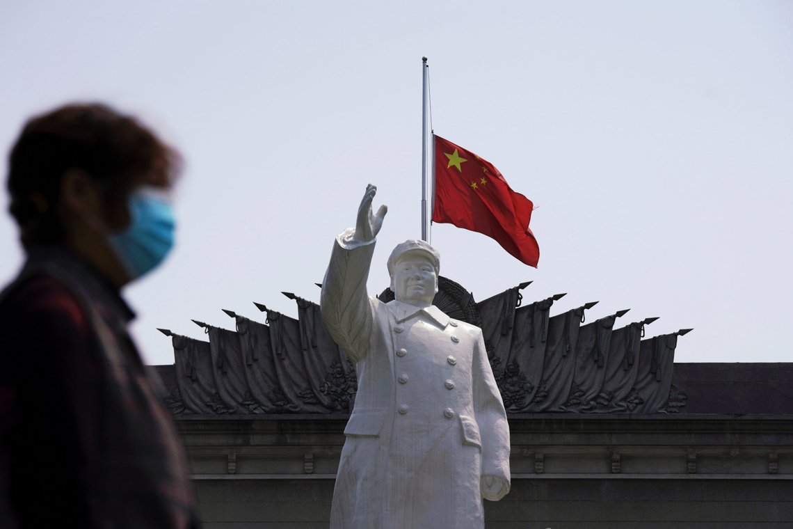 The Chinese national flag flies at half-mast behind a statue of late Chinese chairman Mao Zedong in Wuhan, Hubei province, as China holds a national mourning for those who died of the coronavirus disease (COVID-19), on the Qingming tomb-sweeping festival, April 4, 2020. REUTERS/Aly Song The Chinese national flag flies at half-mast behind a statue of late Chinese chairman Mao Zedong in Wuhan, Hubei province, as China holds a national mourning for those who died of the coronavirus disease (COVID-19), on the Qingming tomb-sweeping festival, April 4, 2020. REUTERS/Aly Song