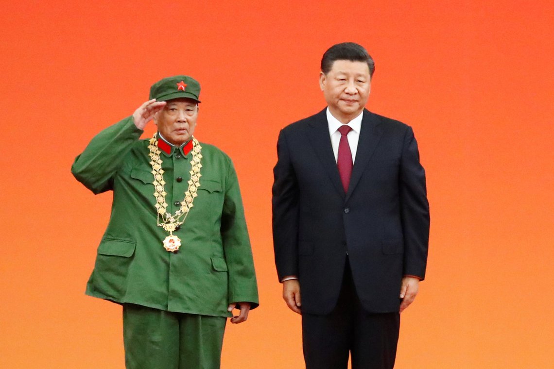 Chinese President Xi Jinping poses with veteran soldier Li Yannian after he awarded him the Medal of the Republic during a ceremony on occasion of the 70th anniversary of the founding of the People's Republic of China at the Great Hall of the People in Beijing, China September 29, 2019. REUTERS/Thomas Peter Chinese President Xi Jinping poses with veteran soldier Li Yannian after he awarded him the Medal of the Republic during a ceremony on occasion of the 70th anniversary of the founding of the People's Republic of China at the Great Hall of the People in Beijing, China September 29, 2019. REUTERS/Thomas Peter